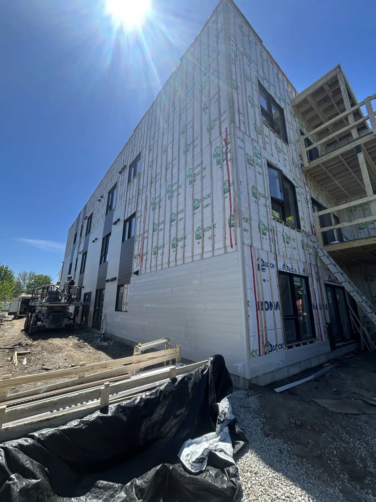 First white steel panels installed at the corner of the building