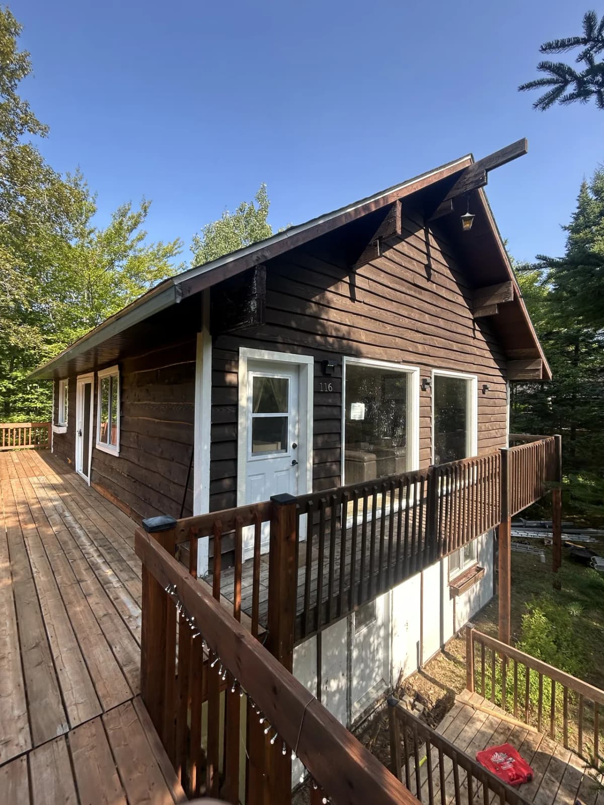 Before the work, the chalet and its dated wood cladding